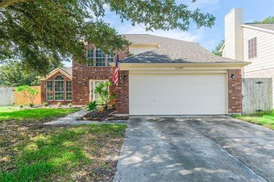 Discover your dream home! This inviting residence boasts a classic brick facade, sun-drenched windows, and a serene, landscaped yard, offering the perfect blend of elegance and comfort. | Image 3