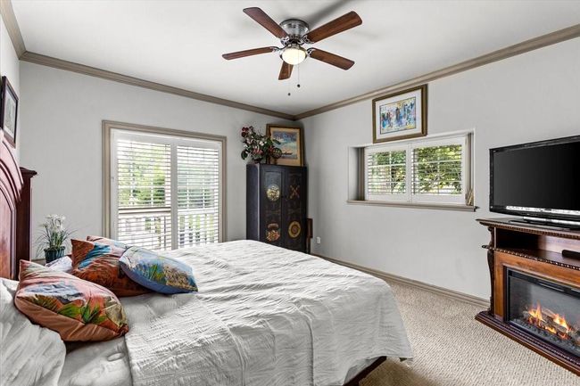 Picture friends and family enjoying your new coastal home—sun streaming through the windows, the soft sound of waves in the distance, and fun filled days on the bay. This 2nd upstairs bedroom isn’t just a place to sleep; it’s a sanctuary for making memories, sharing stories, and embracing the relaxed rhythm of life on the bay. | Image 35