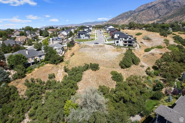 Aerial perspective of suburban area featuring a mountain backdrop | Image 32
