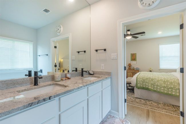 Bathroom with connected bathroom, double vanity, healthy amount of natural light, a ceiling fan, and recessed lighting | Image 20