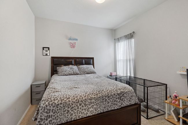 Bedroom featuring light colored carpet and baseboards | Image 13