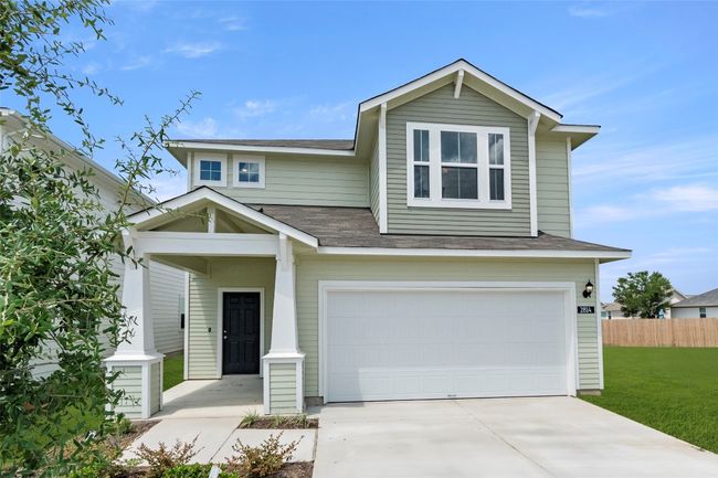 View of front of property with an attached garage, driveway, and roof with shingles | Image 4