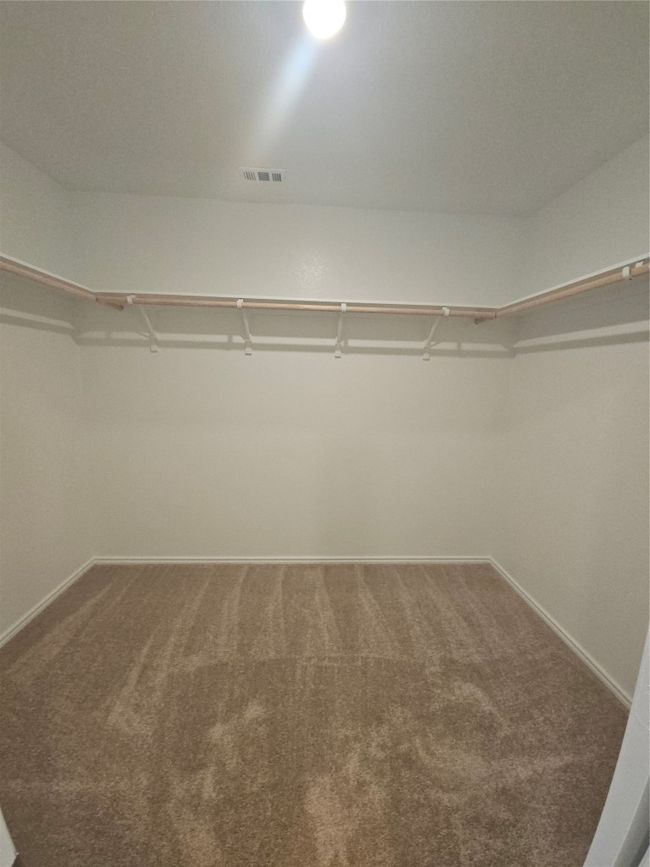 Walk in closet featuring carpet floors | Image 22