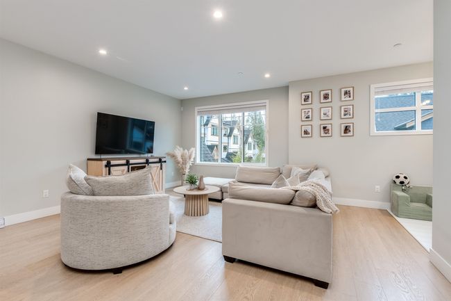 Living room featuring recessed lighting, baseboards, and light wood-type flooring | Image 4