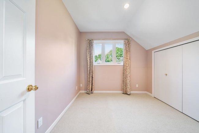 Interior space featuring recessed lighting, vaulted ceiling, light carpet, and baseboards | Image 27
