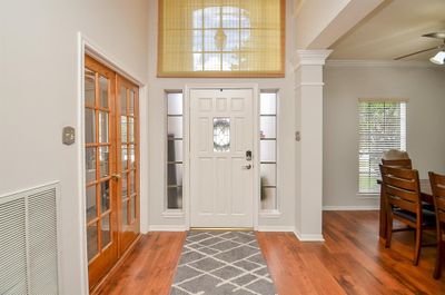 Light and bright entry! This entry is open and welcoming, the home office and dining room just off either side of the two story entry. | Image 2