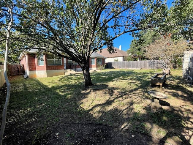 View of fenced backyard | Image 33