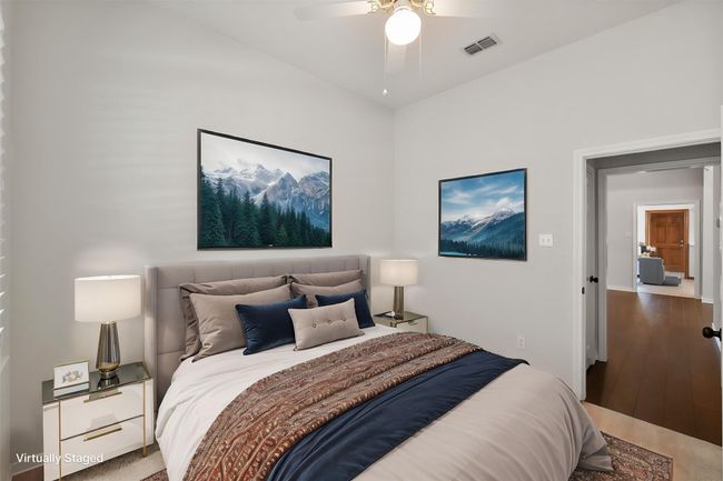 The secondary bedrooms have ceiling fans, recently replaced carpet and windows for natural light. | Image 34