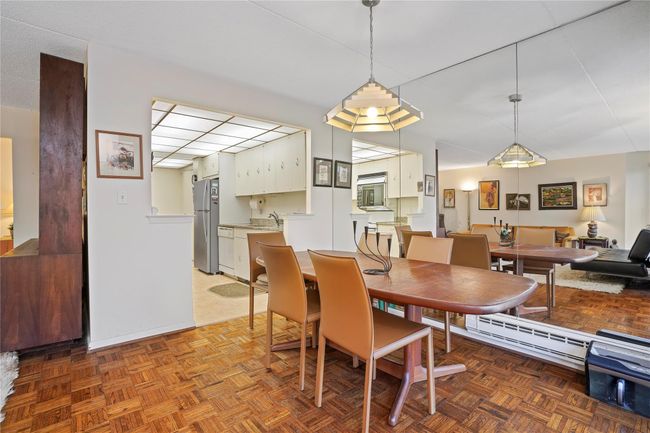 Dining room featuring light parquet flooring and sink | Image 6