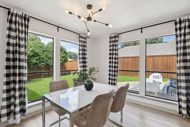 Breakfast area off kitchen with great views of the lush backyard | Image 10