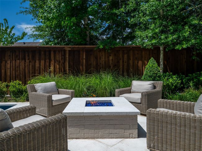 View of patio with an outdoor fire pit | Image 36