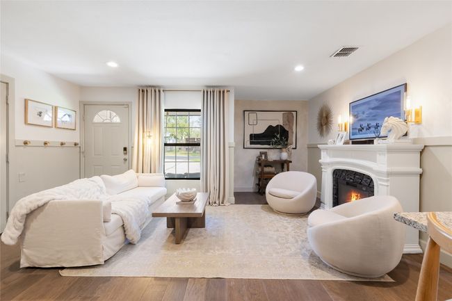 With a full-price offer, the buyer will receive: ? the beautifully styled fireplace ? cozy couch ? two inviting chairs | Image 8