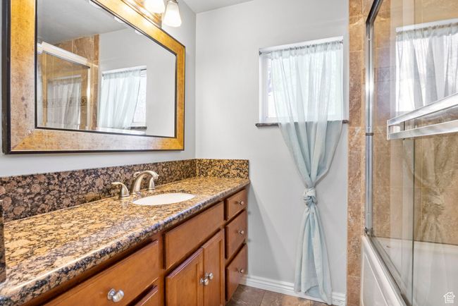 Full bath featuring tile patterned floors and vanity | Image 39