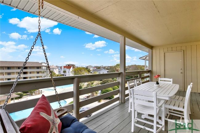 Spacious Balcony with Swing & Storage Closet with View of Pool, Lighthouse & Ocean | Image 32