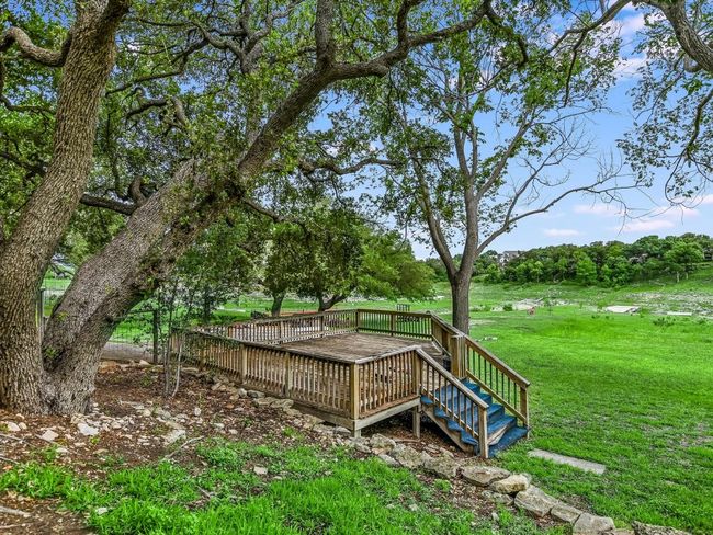 Wooden deck featuring a lawn | Image 20