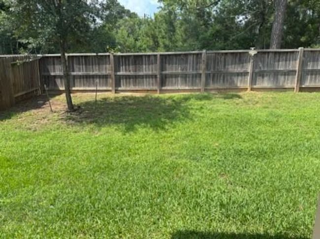 Fenced backyard. | Image 17
