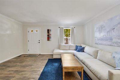 Living room featuring ornamental molding and hardwood / wood-style floors | Image 3