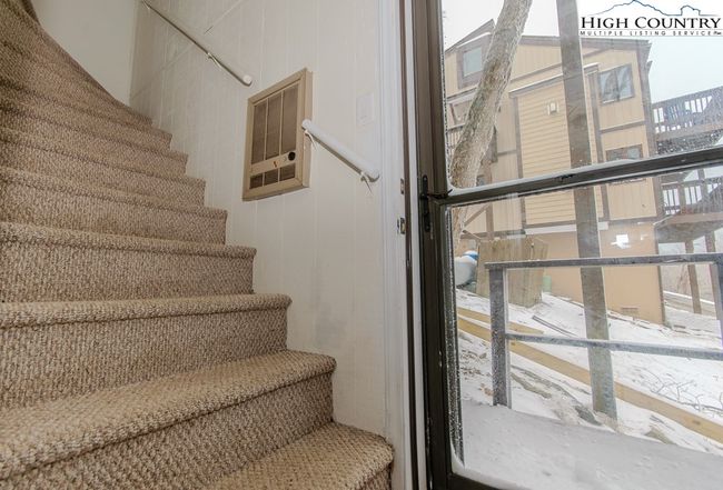 Interior stairs down to and private entrance to lower level bedroom | Image 41