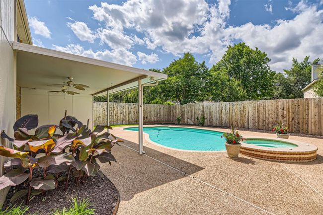 View of pool featuring ceiling fan, a fenced backyard, an in-ground hot tub, and a patio | Image 39
