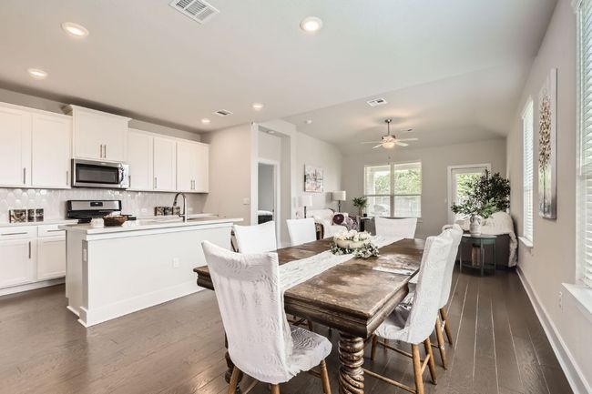 Dining area featuring dark wood-type flooring, recessed lighting, and a ceiling fan | Image 11