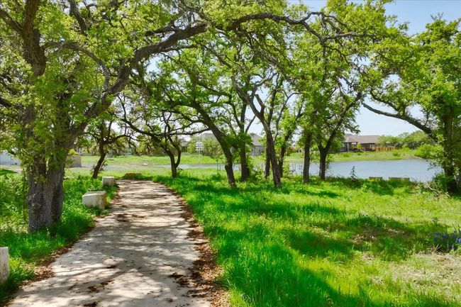View of community walking trail with a water view | Image 15