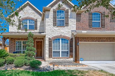 Welcome Home to 12906 Chatfield Manor Lane, Tomball, Texas 77377. Beautiful mix of Brick and Stone Frontage | Image 1