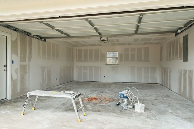 Garage with electric panel and a garage door opener | Image 32