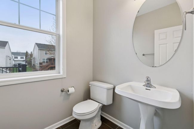 Main floor powder room just off mudroom and garage | Image 13