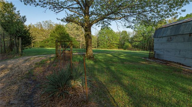 Entrance to backyard and additional acreage | Image 15