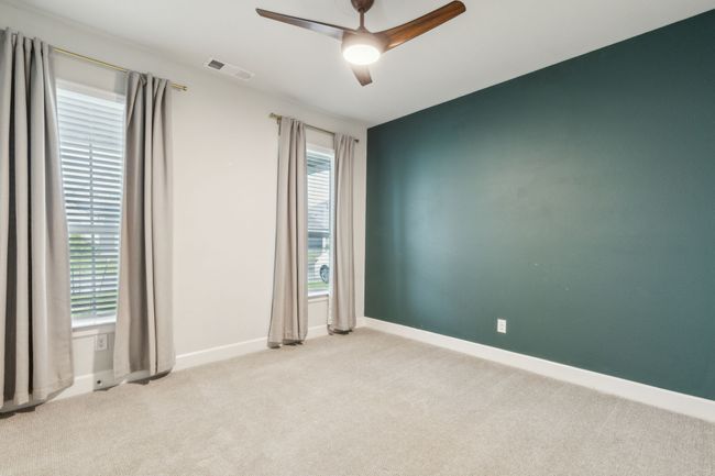 Spare room featuring carpet floors, ceiling fan, and baseboards | Image 20