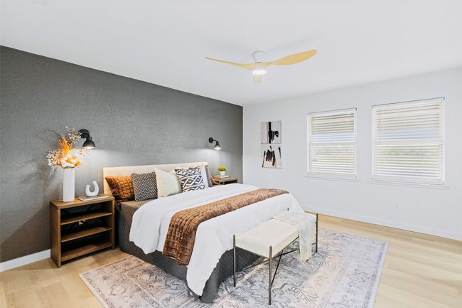 Bedroom with wood finished floors and a ceiling fan | Image 15