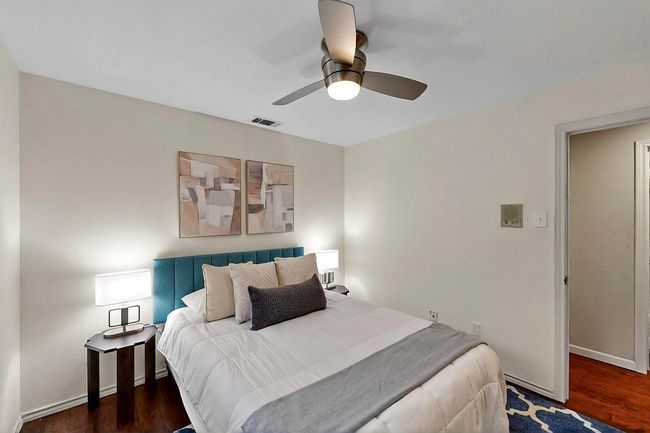Bedroom featuring wood finished floors and ceiling fan | Image 23