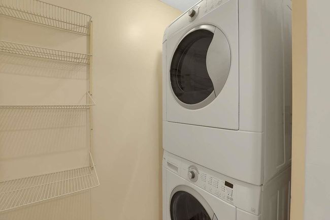 Washroom featuring estacked washer and dryer | Image 20