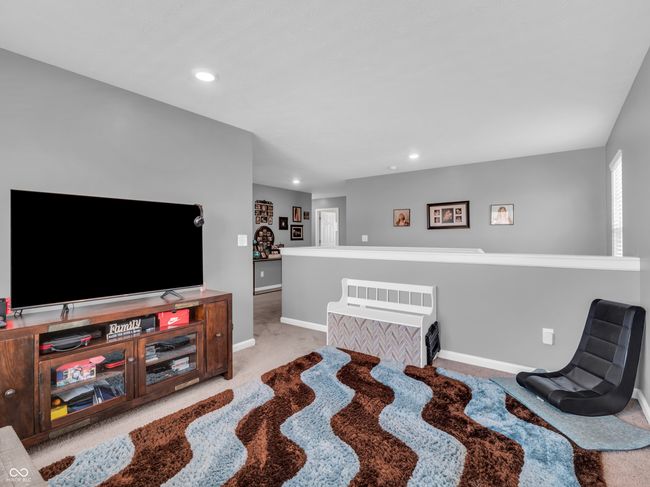 living area featuring baseboards, recessed lighting, and carpet | Image 20