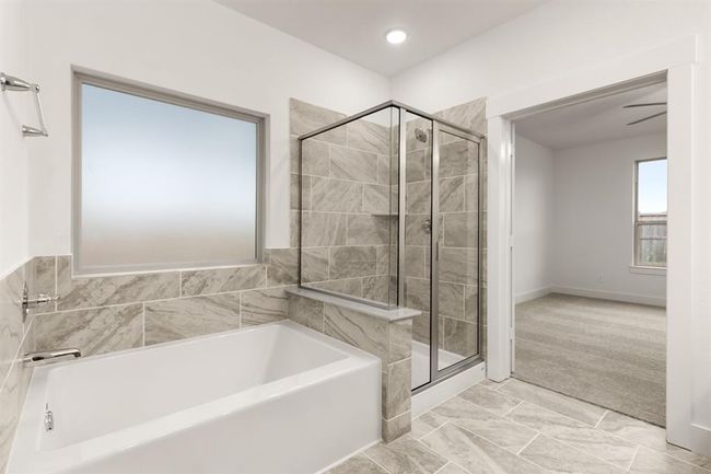 Rinse off the stresses of your day in this oversized shower. | Image 17