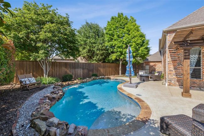 View of pool with a patio | Image 32