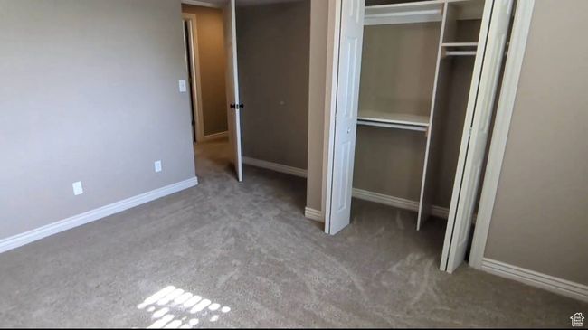 Unfurnished bedroom featuring carpet, a closet, and baseboards | Image 55