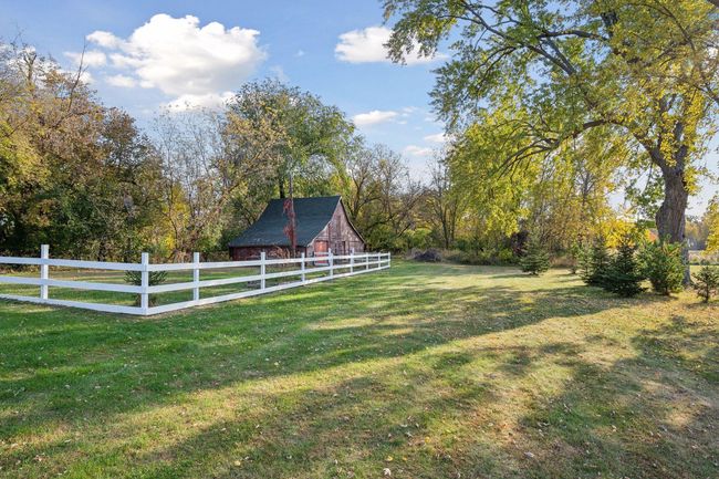 Fenced area and old grain shed currently used for storage. | Image 51