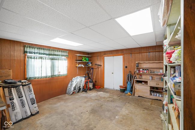 garage with wooden walls | Image 32