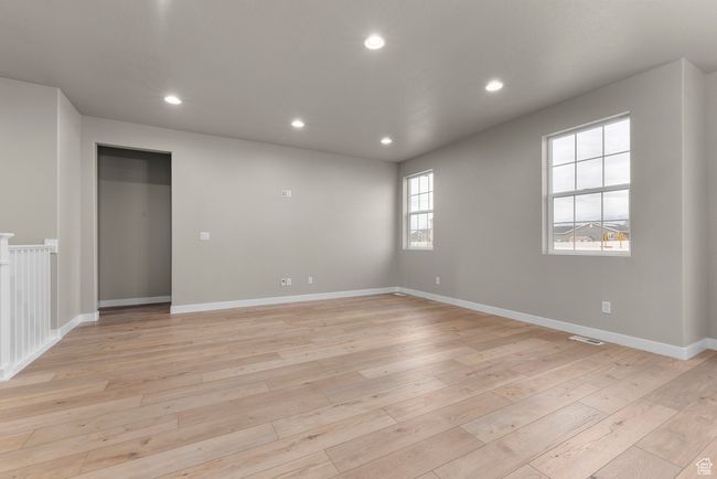 Spare room with light wood-style floors, recessed lighting, and baseboards | Image 7
