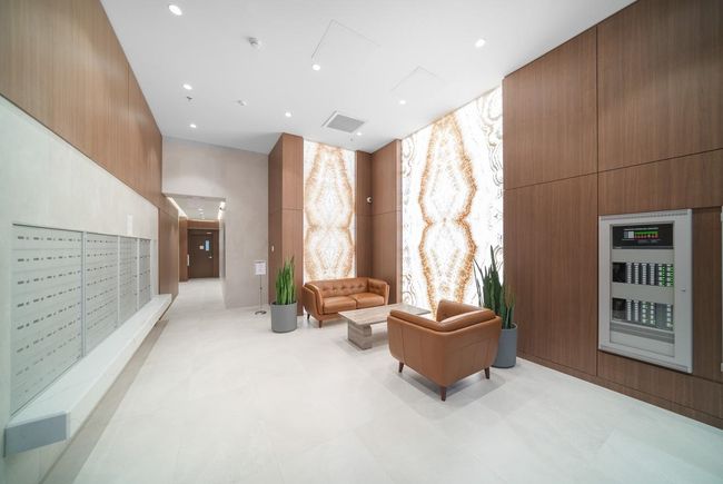 Community lobby with a high ceiling and recessed lighting | Image 19