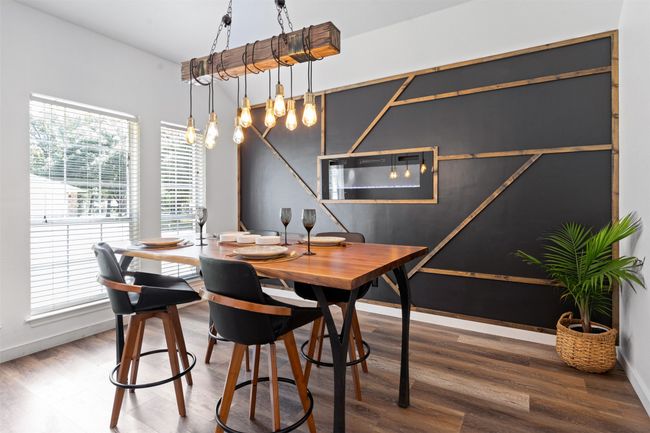 Dining room featuring wood-type flooring | Image 8