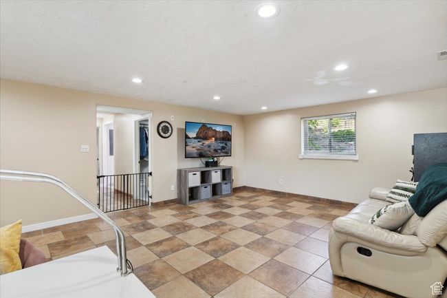Family room featuring recessed lighting, natural light, and tile floors | Image 27