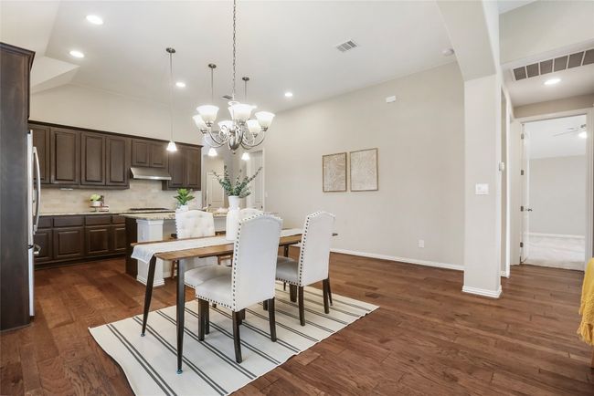 Dining area looking at kitchen and primary hall | Image 5