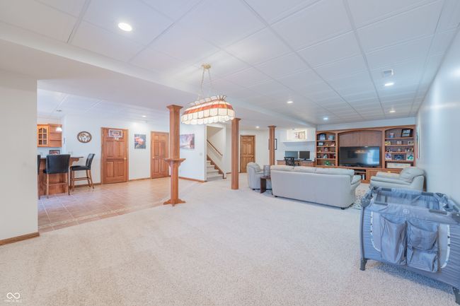 Recreation area featuring recessed lighting, carpet, baseboards, and stairway | Image 18