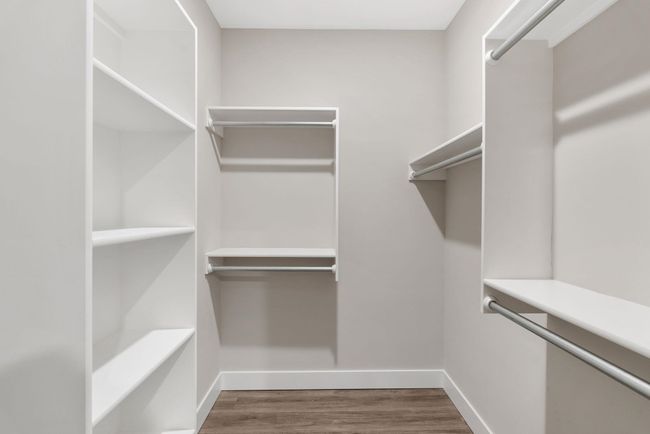 Spacious closet featuring wood finished floors | Image 21