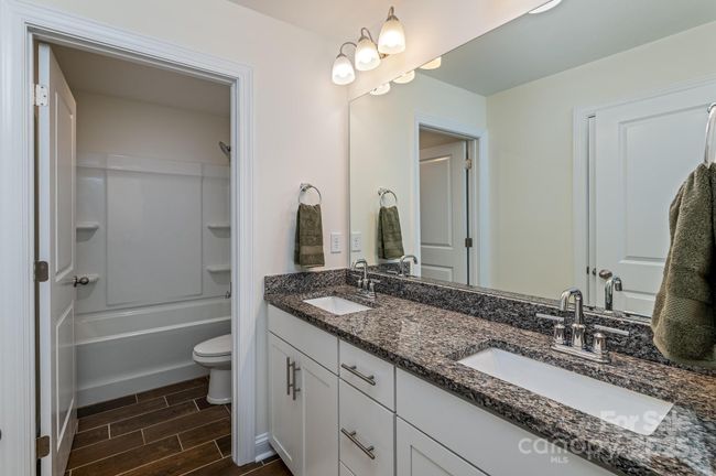 Upstairs bathroom with double sink shower/tub | Image 24