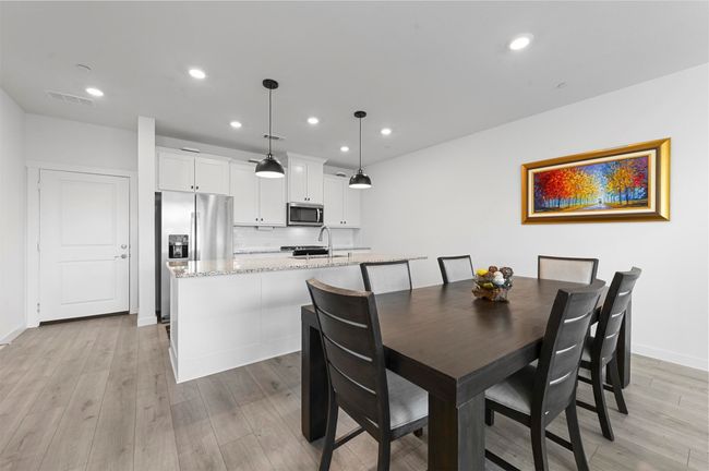 Dining space with sink and light wood-type flooring | Image 7