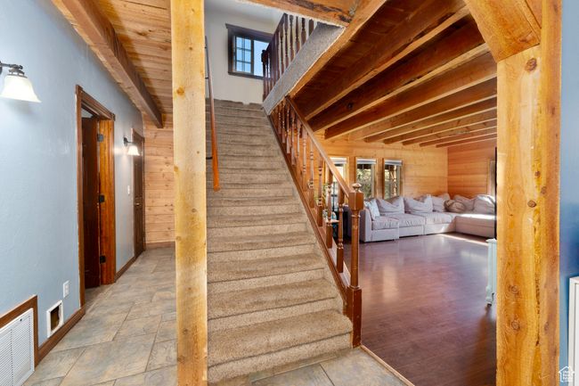 Stairs with wooden walls and healthy amount of natural light | Image 21