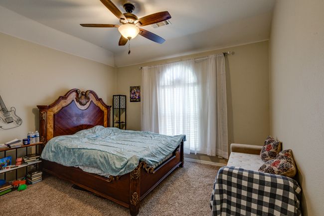 Bedroom with carpet and a ceiling fan | Image 27